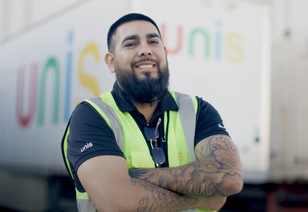 Smiling worker in safety vest