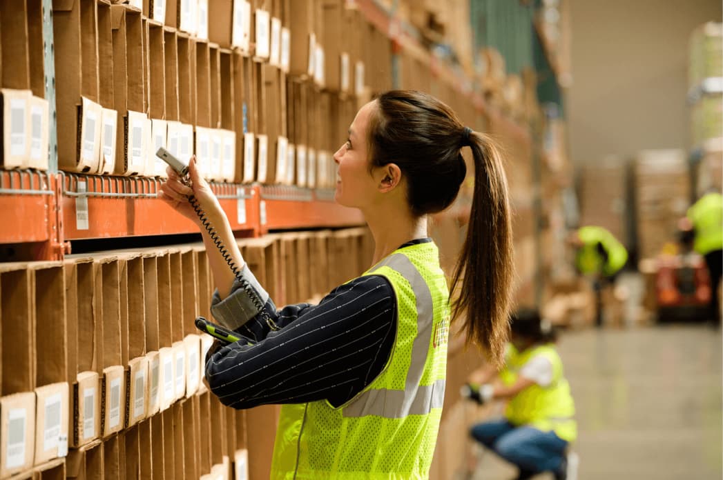 Worker doing inventory in warehouse