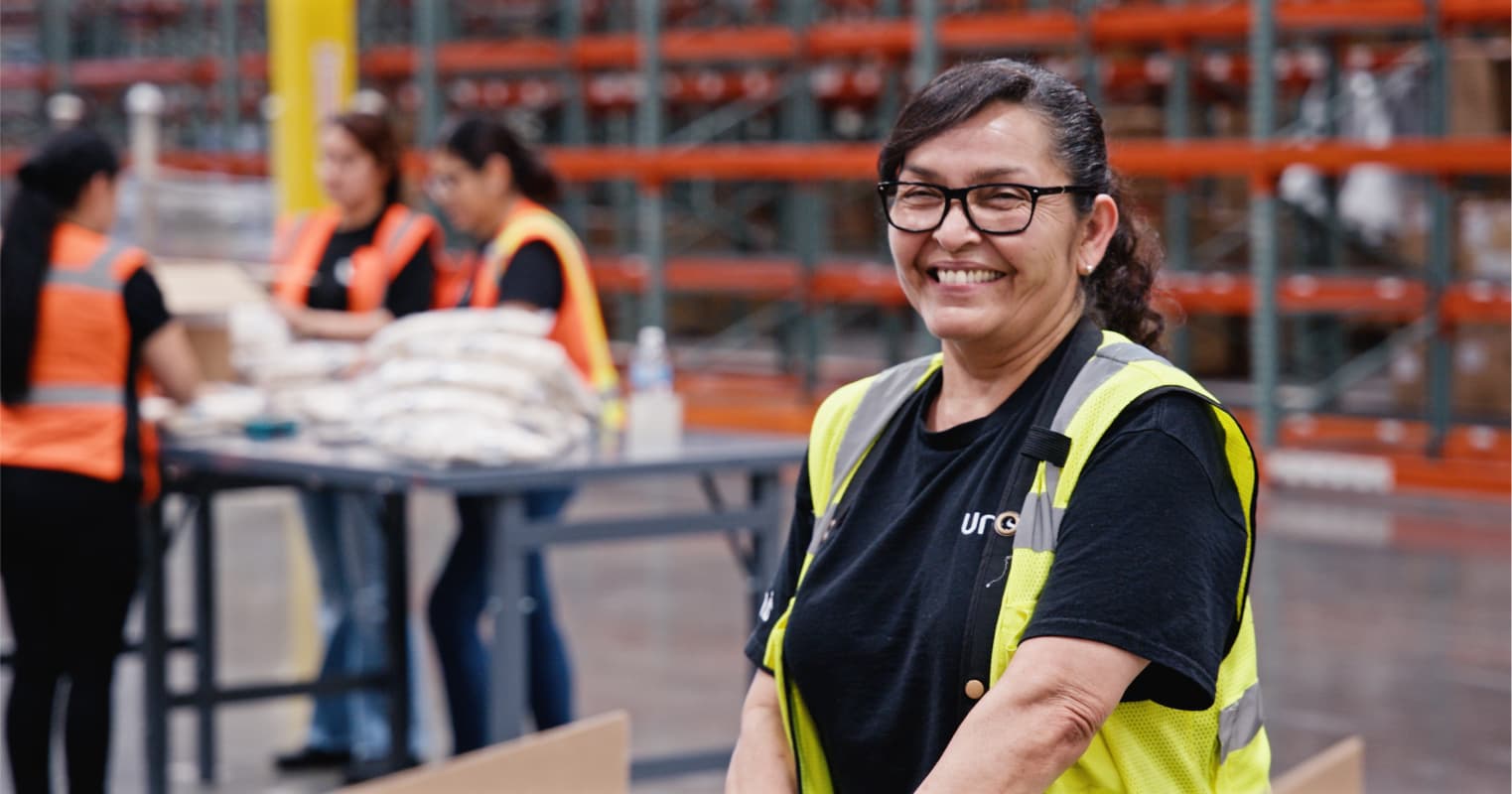 Smiling worker in safety vest